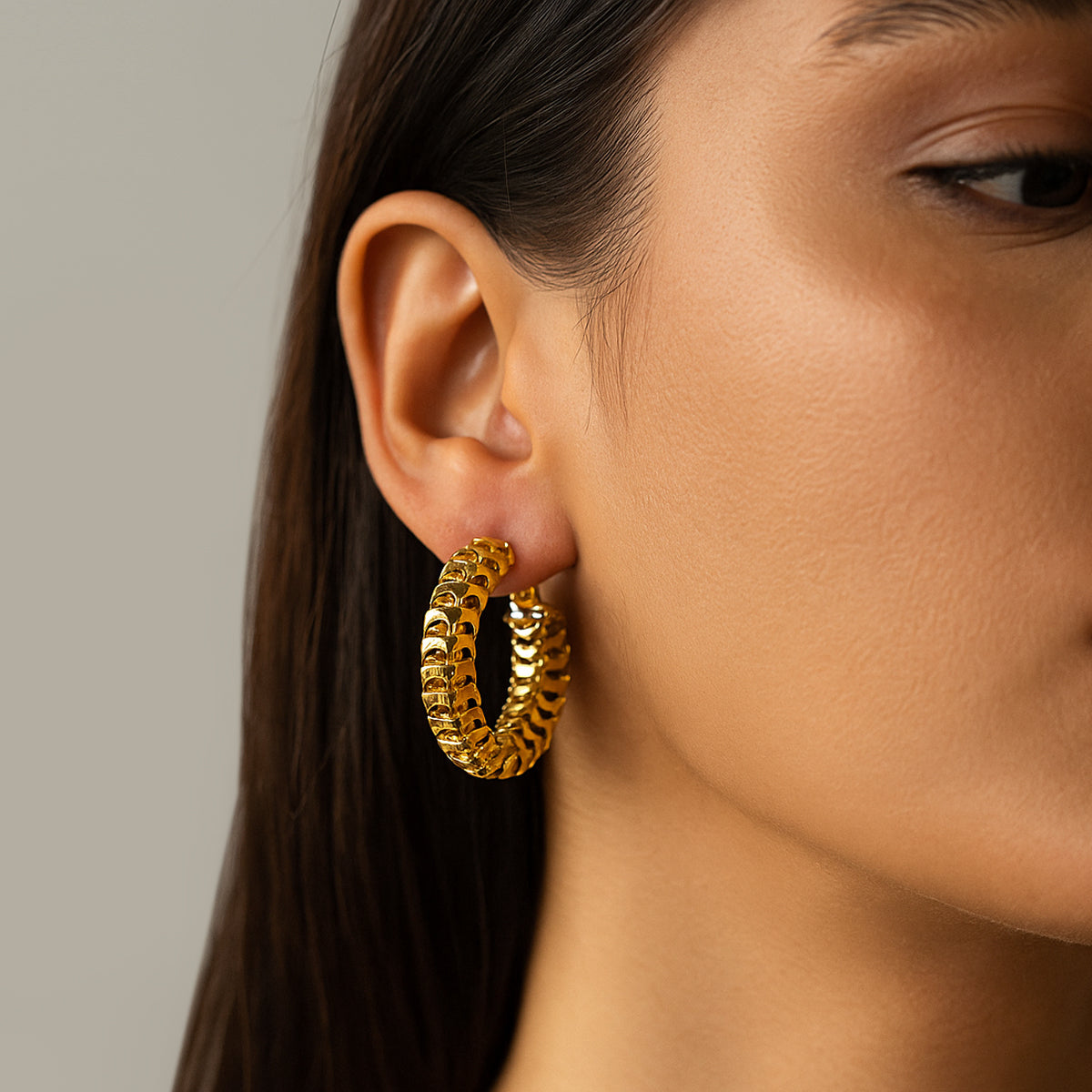 Twisted golden hoops